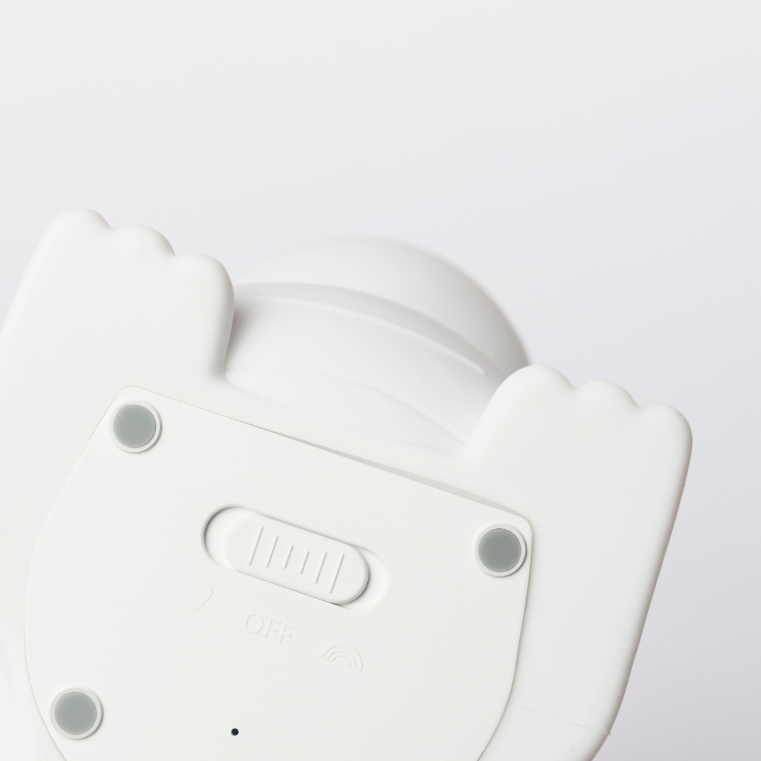 The bottom of the nightlight dinosaur showing the on and off switch