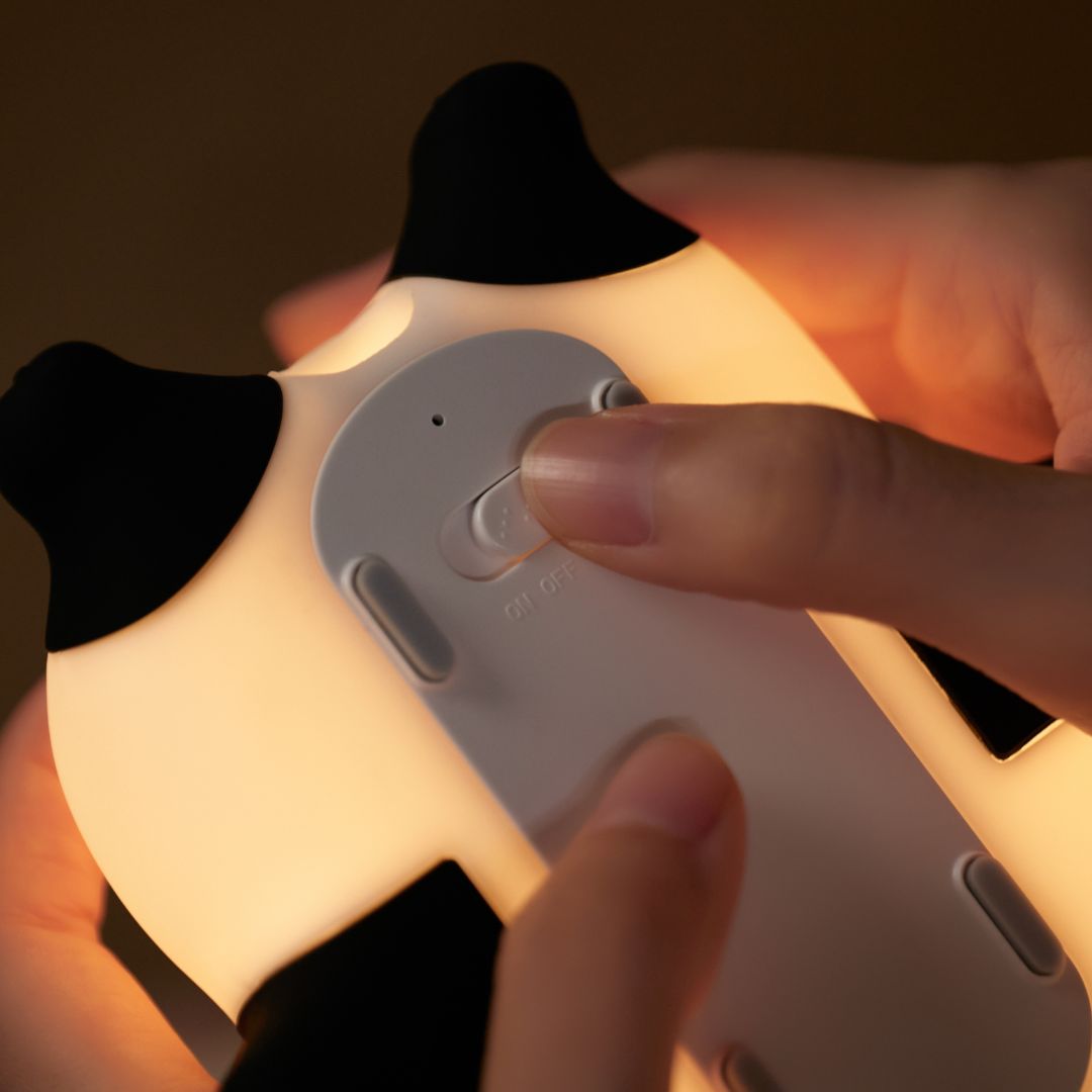 Someone turning the panda nightlight on