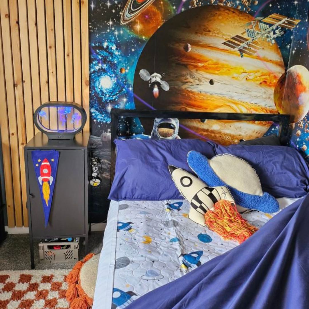 Space themed bedroom using the space design waterproof mattress protector.