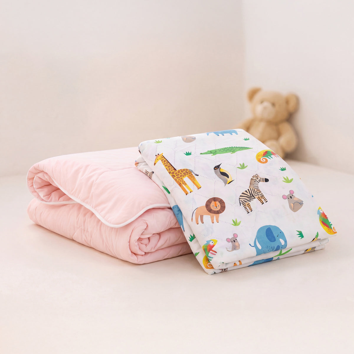 Pink coverless duvet and safari waterproof sheet bundle.