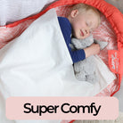 Little boy sleeping in a sleeping bag with his waterproof liner
