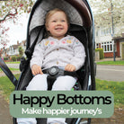 Child in a pram using the dinosaur protector with 'Happy Bottoms' text overlay