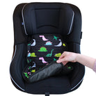 Black car seat with a dinosaur designed car seat protector being adjusted by a hand on a white background