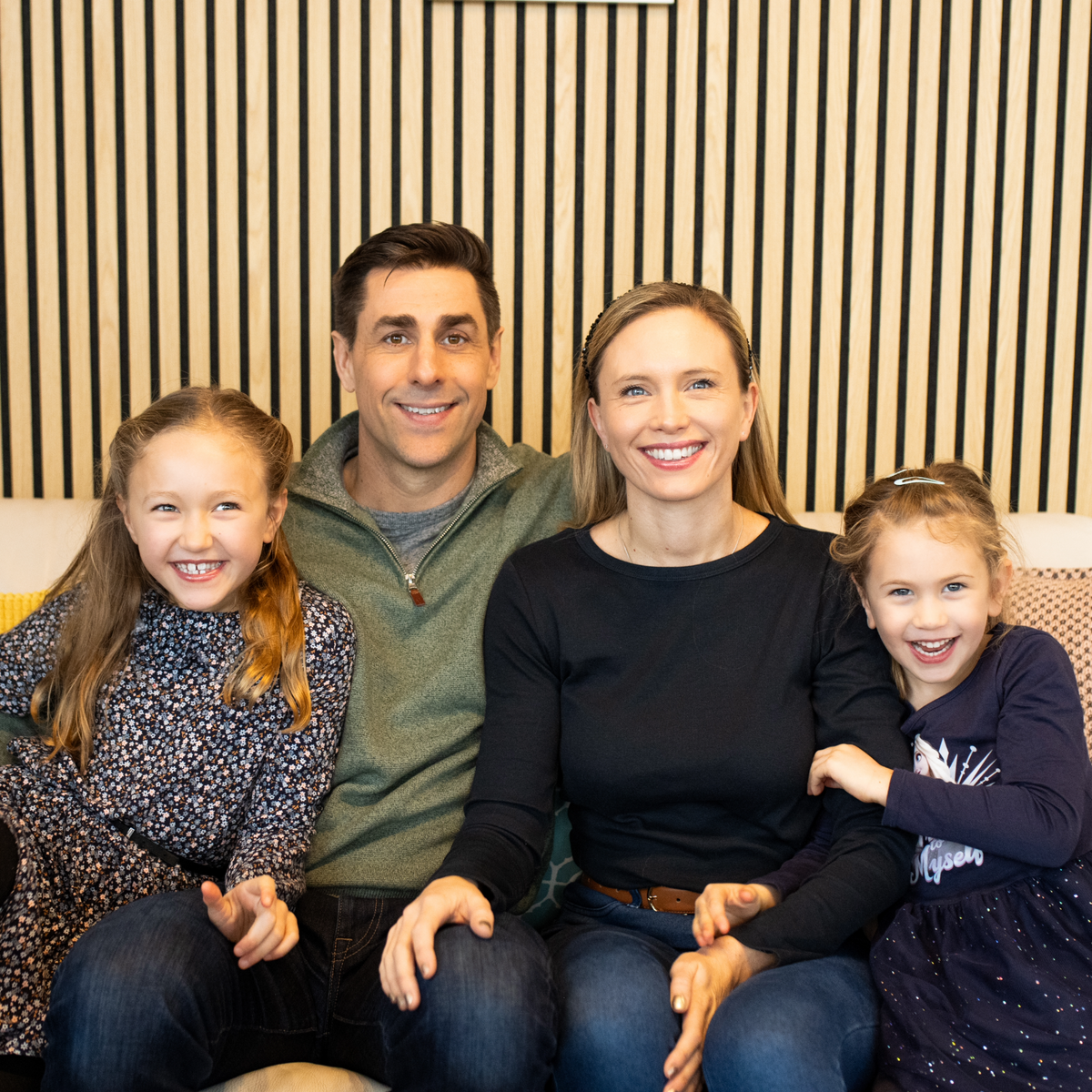 Hygge founder family portrait with two parents and their children