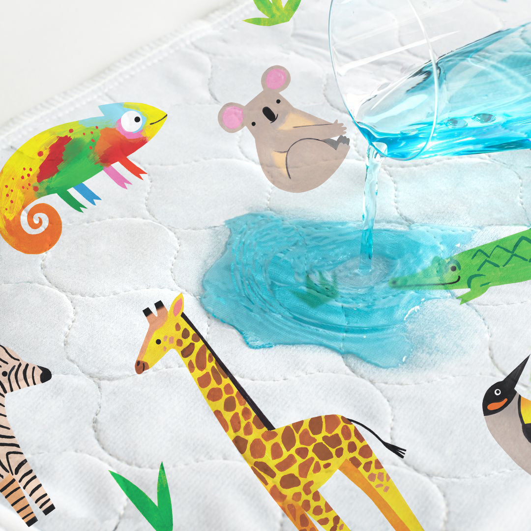 Liquid spilled onto a Safari print Hygge waterproof bed pad