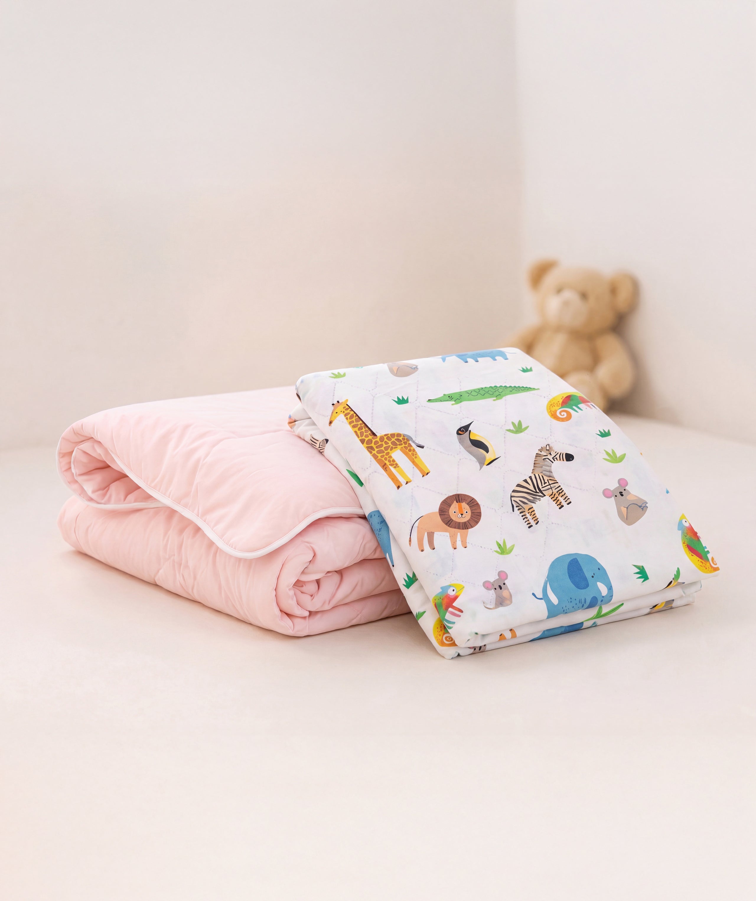 Pink coverless duvet and safari waterproof sheet bundle.